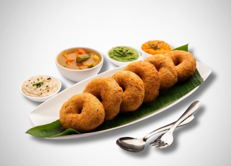Crispy medu vada served with chutney and sambar