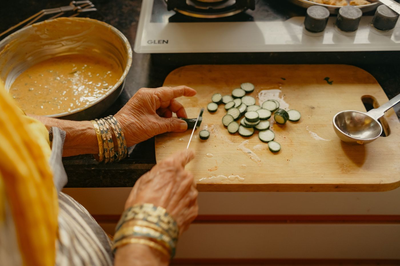 Preparing fresh South Indian food in The Divine Kitchen's home kitchen